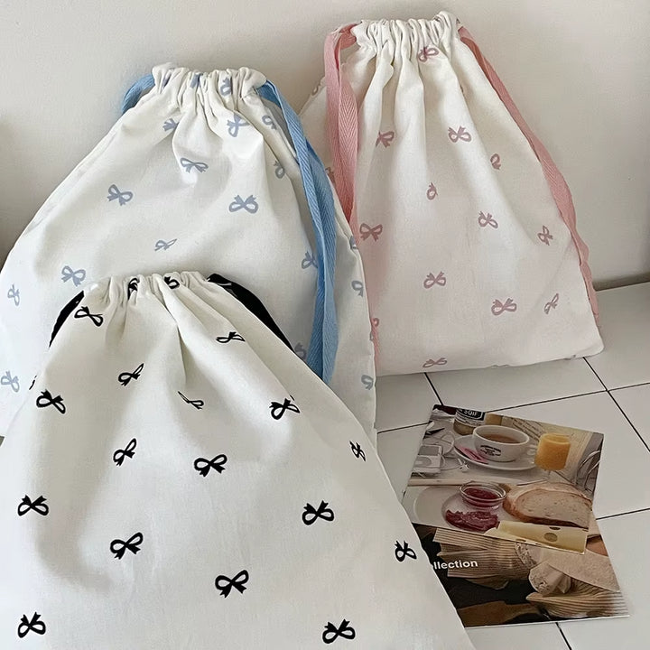 Pochette à liens et nœud — rose, bleu ou noir