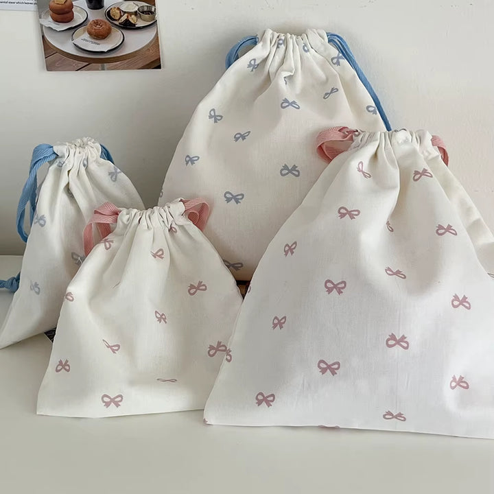 Pochette à liens et nœud — rose, bleu ou noir
