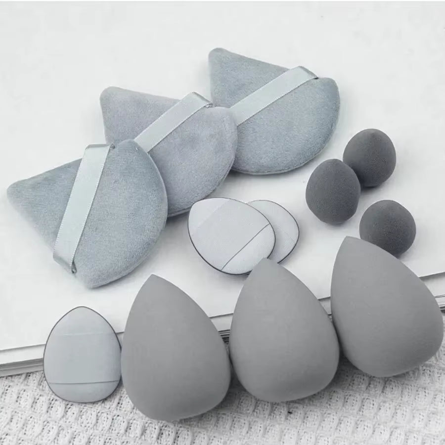 Lot de douze houppettes de maquillage grises