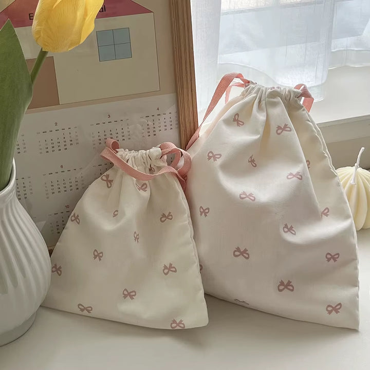 Pochette à liens et nœud — rose, bleu ou noir
