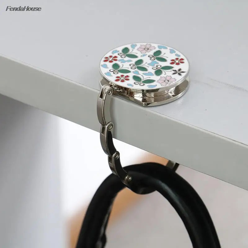 Accroche-sac de table pliable