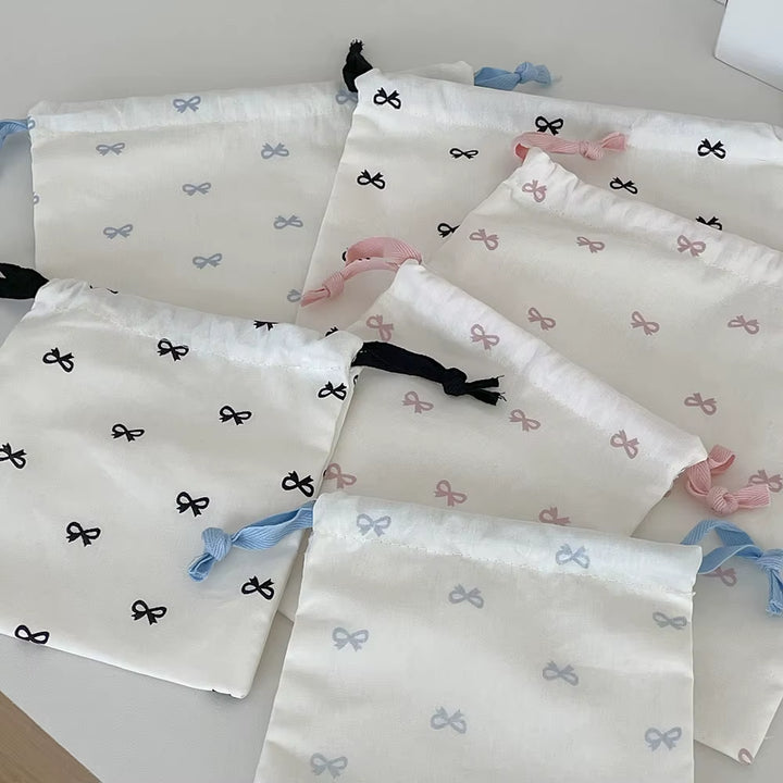 Pochette à liens et nœud — rose, bleu ou noir