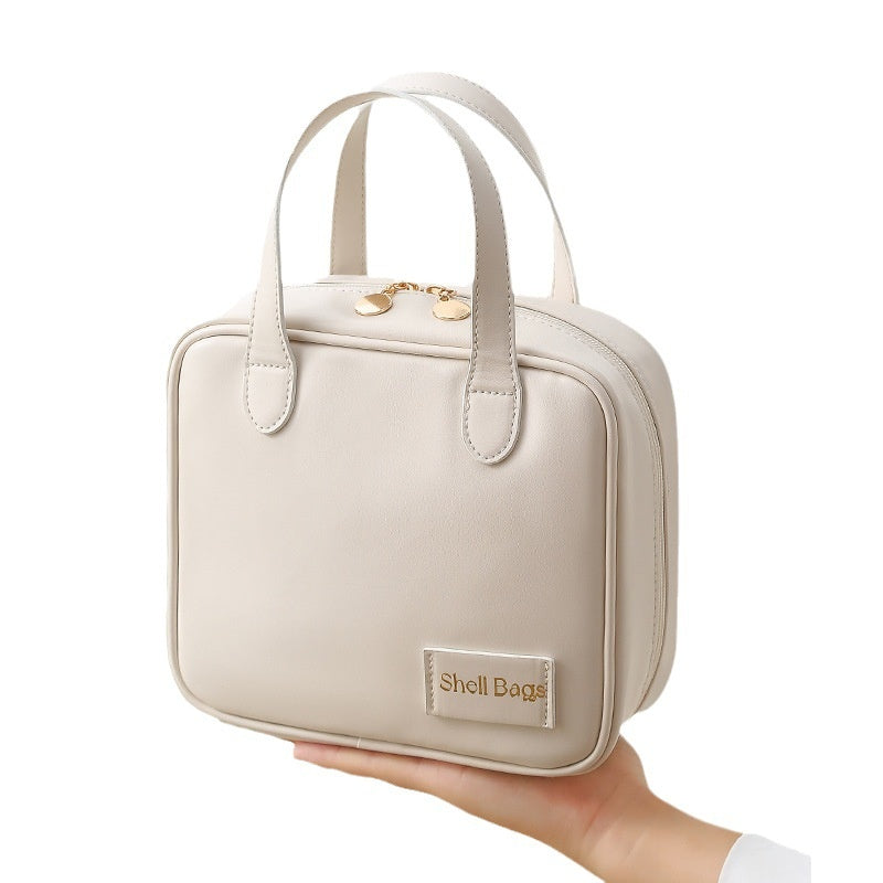 Trousse de maquillage ivoire, vue fournisseur. Accessoires non inclus.